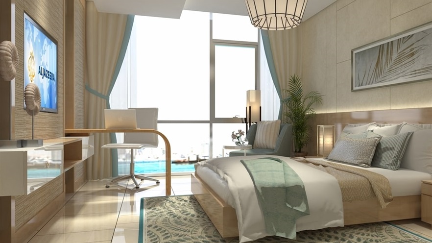 Large bedroom in beige tones with glass openings