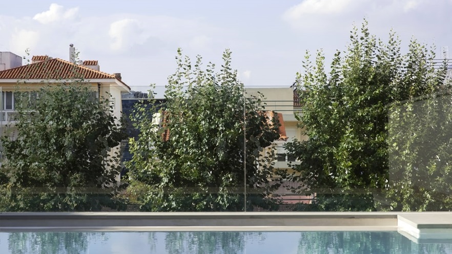 The pool overlooks some trees