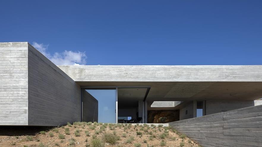 House made of concrete, corner window open