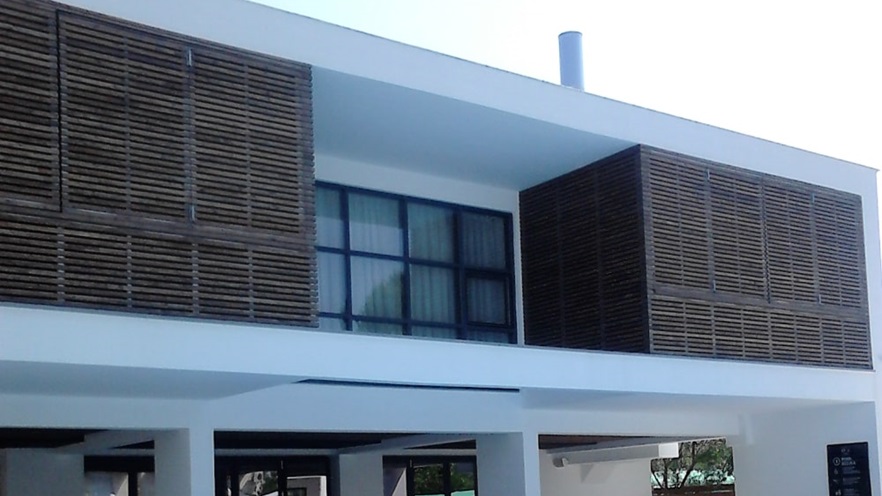 Hotel façade made of wood and windows