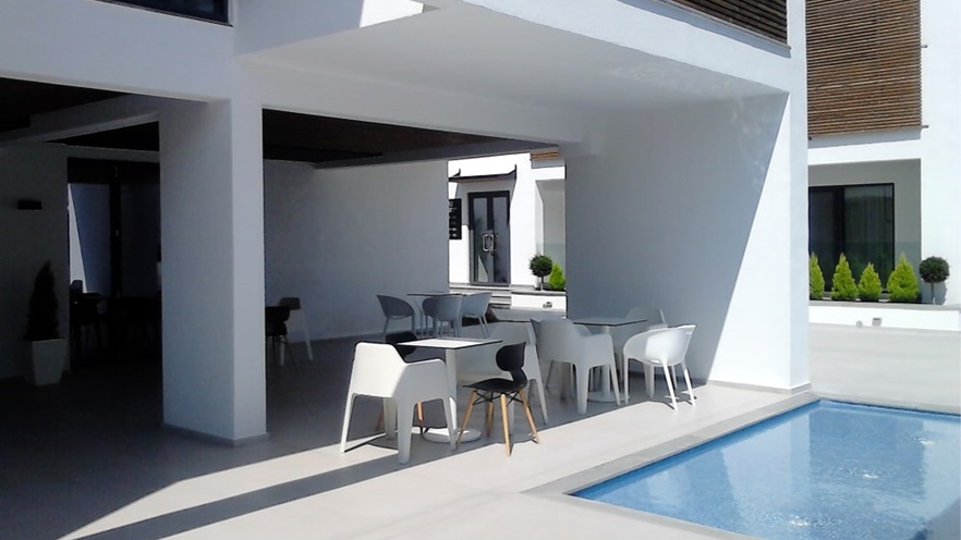 Terrace with tables and pool