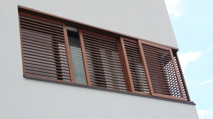 Aluminum windows with brown shutters